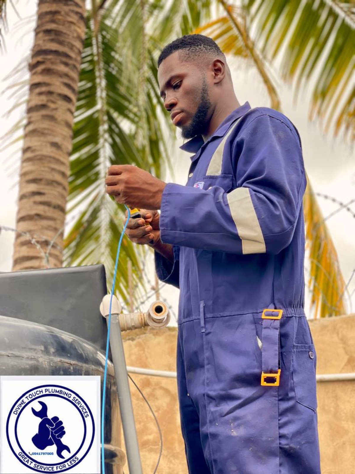 Divine Touch plumber on a job in Accra